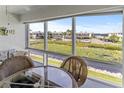 Lanai with water views and wicker furniture at 4819 Independence Dr # 4819, Bradenton, FL 34210