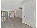 Open living room with tile floors and views into kitchen at 906 E Venice Ave, Venice, FL 34285