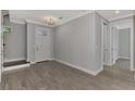 Bright entryway with tile flooring and views to staircase and hallway at 906 E Venice Ave, Venice, FL 34285