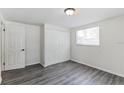 Bright bedroom featuring new flooring and built-in closet at 403 Pinewood Ave, Nokomis, FL 34275