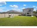 Large backyard with grassy area and privacy fence at 5873 Bungalow Grove Ct, Palmetto, FL 34221