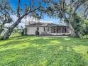 Spacious backyard with a large deck and screened patio at 2843 Abbotsford St, North Port, FL 34287