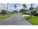 Landscaped community with paved roads and lush greenery at 6023 Hibiscus Dr # 177, Bradenton, FL 34207