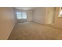 Spacious living room with carpeted floors at 6023 Hibiscus Dr # 177, Bradenton, FL 34207