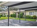 Exterior view of condo with carport and landscaping at 2708 60Th Avenue W Ter # A, Bradenton, FL 34207