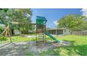 Backyard with playset, providing ample space for children at 3772 Desoto Rd, Sarasota, FL 34235