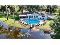 House with pool and backyard access to a lake at 1810 67Th Street E Ct, Bradenton, FL 34208