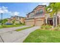 Two story townhome with attached two car garage and manicured lawn at 7854 52Nd E Ter # 52, Bradenton, FL 34203