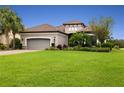 One-story home with gray garage door and manicured lawn at 4803 Cabreo Ct, Bradenton, FL 34211