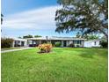 Charming single story home with lush lawn and mature landscaping at 2907 Marshall Dr, Sarasota, FL 34239