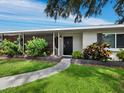 Modern home exterior with walkway and landscaped planters at 2907 Marshall Dr, Sarasota, FL 34239