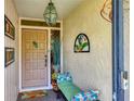 Inviting entryway with seating and unique decor at 3541 Wilkinson Woods Dr # 40, Sarasota, FL 34231