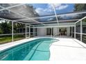 Inviting kidney-shaped pool with screened enclosure at 4724 Seville Dr, Sarasota, FL 34235