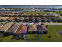 Aerial view of a home with pool and backyard in a waterfront community at 1922 6Th St E, Palmetto, FL 34221