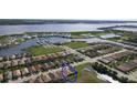 Aerial view showcasing a waterfront community with a single-Gathering home highlighted at 1922 6Th St E, Palmetto, FL 34221
