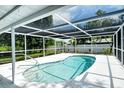 Inviting screened-in pool with a relaxing atmosphere at 4724 Seville Dr, Sarasota, FL 34235