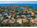 Aerial view of single Gathering home in upscale waterfront community at 12313 Baypointe Ter, Cortez, FL 34215