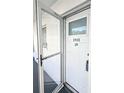 White front door with glass panel and storm door at 5933 17Th W St # A24, Bradenton, FL 34207