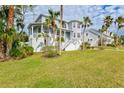 Charming two-story house with a well-manicured lawn at 3811 Bayside Cir, Bradenton, FL 34210