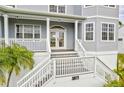 Elegant house entrance with white columns and stairs at 3811 Bayside Cir, Bradenton, FL 34210