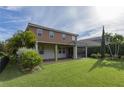 Home with covered patio and spacious backyard at 2824 Esmeralda Dr, Sarasota, FL 34243