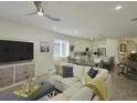 Spacious living room with open floor plan and comfortable seating at 5827 Mezzana Run, Palmetto, FL 34221