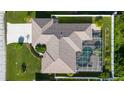 Bird's eye view showing the house layout, pool, and surrounding landscape at 10268 Alexandria Ave, Englewood, FL 34224