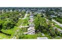 Aerial view of a home with a large backyard near a canal at 2631 Fiesta Dr, Venice, FL 34293