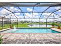 Screened pool and patio area overlooking a lake at 16162 61St E Ln, Parrish, FL 34219