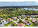 Aerial view of a cul-de-sac neighborhood with lake view at 5111 51St W Ln, Bradenton, FL 34210