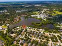 Property view showcasing home's location near a lake at 7305 Mauna Loa Blvd, Sarasota, FL 34241