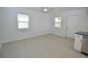 Bright and airy living room with tile floors and ceiling fan at 3519 17Th E St, Bradenton, FL 34208