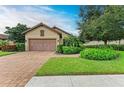 Spanish-style home with landscaped yard at 5435 Lago Maggio St, Sarasota, FL 34238