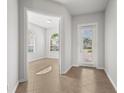 Bright and airy entryway with tile flooring and access to an interior room at 13180 Ipolita St, Venice, FL 34293