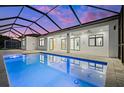 Inviting pool and patio area with a covered lanai, perfect for entertaining at 45 Bunker Ln, Rotonda West, FL 33947