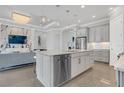 Modern kitchen with island, stainless steel appliances, and breakfast bar at 4507 Terrazza Ct, Bradenton, FL 34211