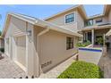 Front view of two-story house with attached garage at 1736 Starling Dr # 202, Sarasota, FL 34231