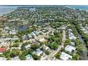 Aerial view of a waterfront community with lush greenery and easy access to the bay at 136 Crescent Dr, Anna Maria, FL 34216