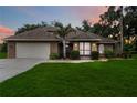 Brick home with screened porch and nicely landscaped yard at 7425 36Th E Ave, Palmetto, FL 34221