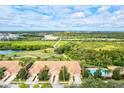 Aerial view of a villa community near a golf course and pool at 9035 Stone Harbour Loop, Bradenton, FL 34212