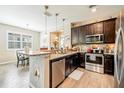 Modern kitchen with stainless steel appliances and granite countertops at 8798 Tuscany Isles Dr, Punta Gorda, FL 33950