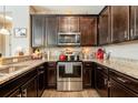Modern kitchen with stainless steel appliances and granite countertops at 8798 Tuscany Isles Dr, Punta Gorda, FL 33950