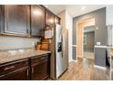 Modern kitchen with stainless steel appliances and granite countertops at 8798 Tuscany Isles Dr, Punta Gorda, FL 33950