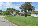 House exterior view from the street, showing a large yard at 6106 45Th W St, Bradenton, FL 34210