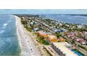 Aerial view of beachfront property showing its proximity to the beach and other coastal homes at 1900 Gulf N Dr # 1, Bradenton Beach, FL 34217
