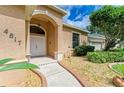 Inviting house exterior featuring a double door entry and well-manicured landscaping at 4817 Shadyview Ct, Sarasota, FL 34232