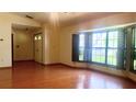 Bright living room with hardwood floors and large windows at 7607 9Th Avenue Nw Dr, Bradenton, FL 34209