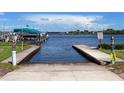 Private boat dock with access to the water, featuring two ramps and boat slips at 3 Palm Ave, Bradenton, FL 34208