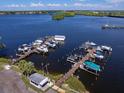 Aerial view of a marina with numerous boats docked at various piers at 3 Palm Ave, Bradenton, FL 34208