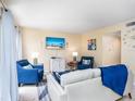 Living room features a neutral color palette and comfortable seating for guests at 6157 Midnight Pass Rd # A51, Sarasota, FL 34242